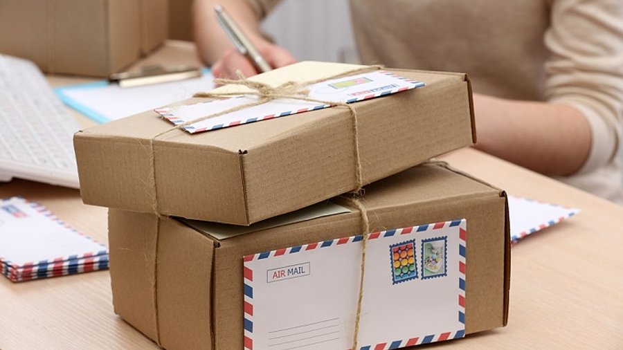 Cardboard boxes on work place in post office