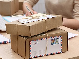 Cardboard boxes on work place in post office