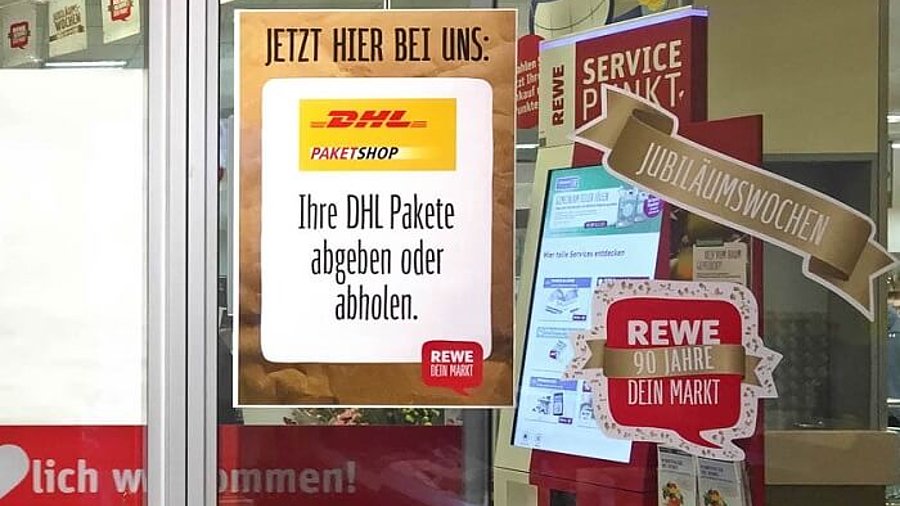 DHL Paketshop Aufkleber Rewe Filiale