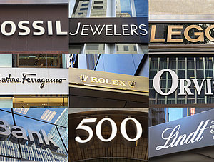 Logos bekannter Marken an der 5th Avenue