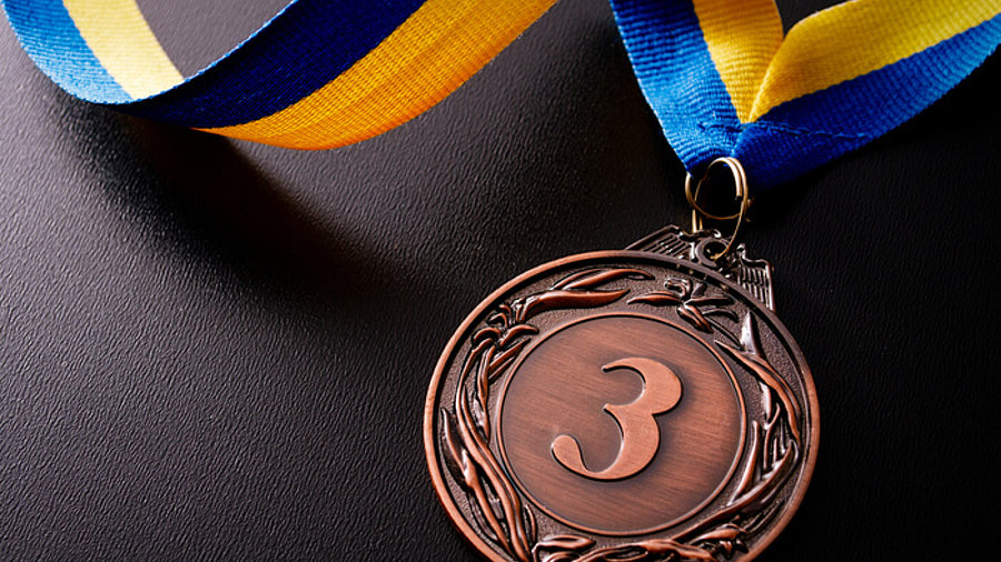 Bronze-Medaille auf dunklem Grund