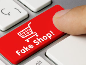 Taste auf einer Tastatur in rot mit der Aufschrift: Fake Shop